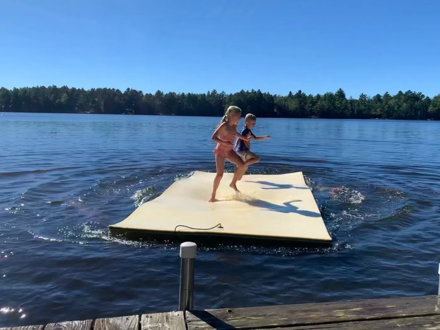 Kids Playing on a Swim Raft in Phelps